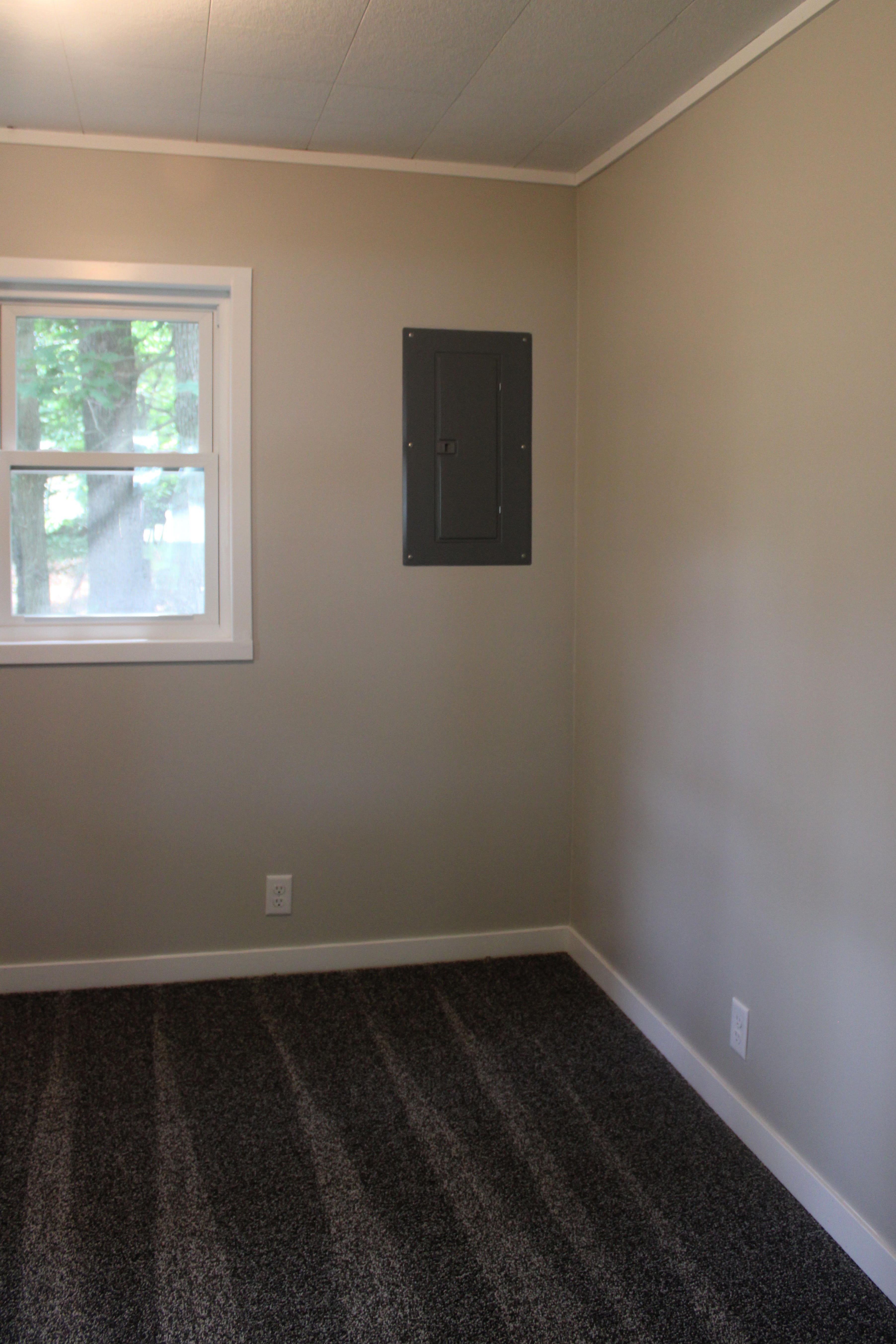 After — new bathroom with corner shower and window