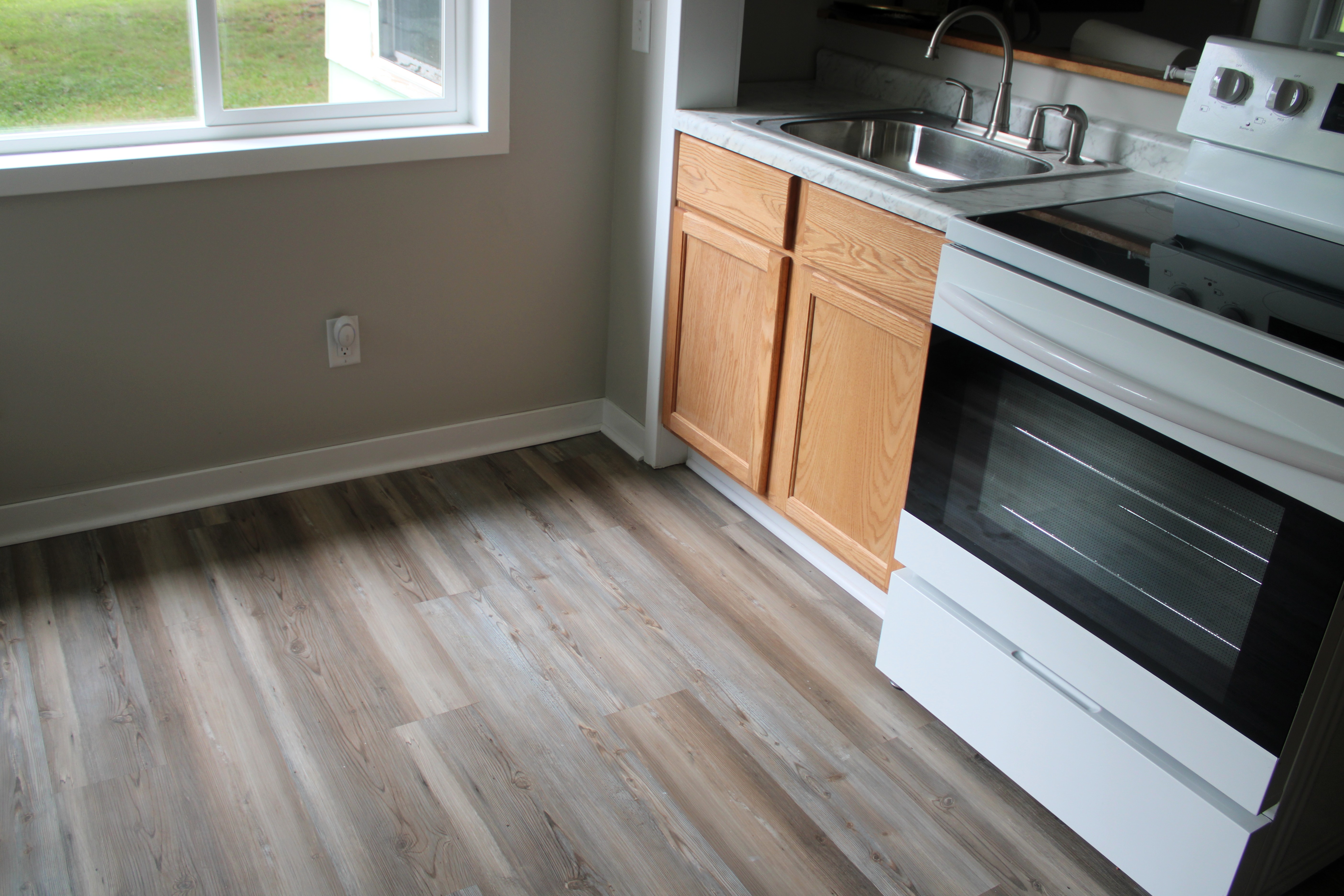 After — LVP flooring detail, kitchen